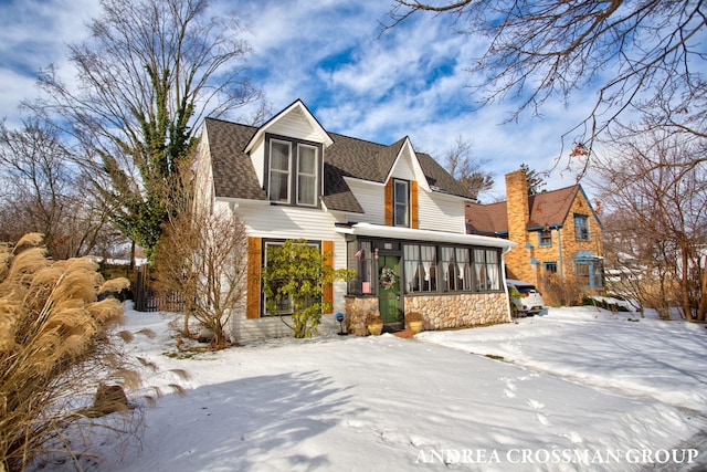 view of front of home with a sunroom