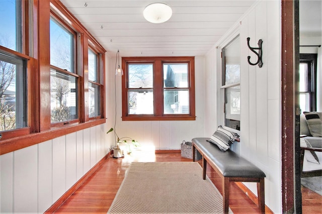 sunroom / solarium featuring wood ceiling