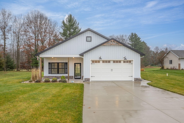 modern farmhouse featuring a garage and a front lawn