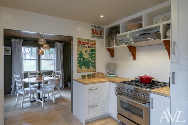 kitchen with white cabinets, stainless steel range, wood counters, and open shelves