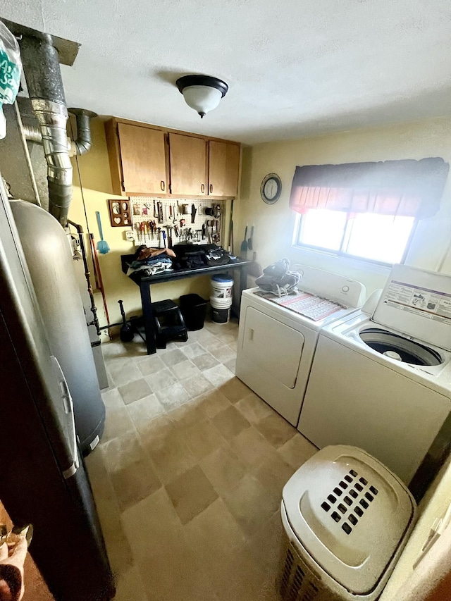 laundry area with cabinets and independent washer and dryer