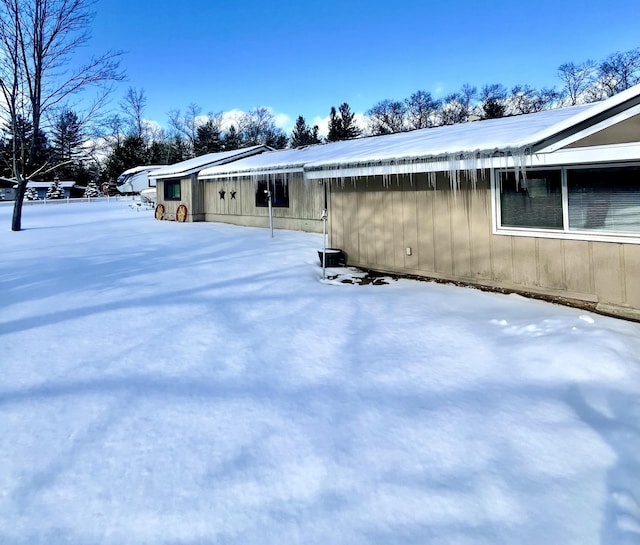 view of snow covered property