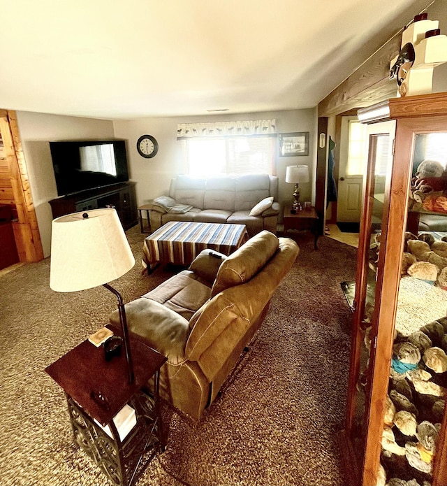 carpeted living room featuring vaulted ceiling