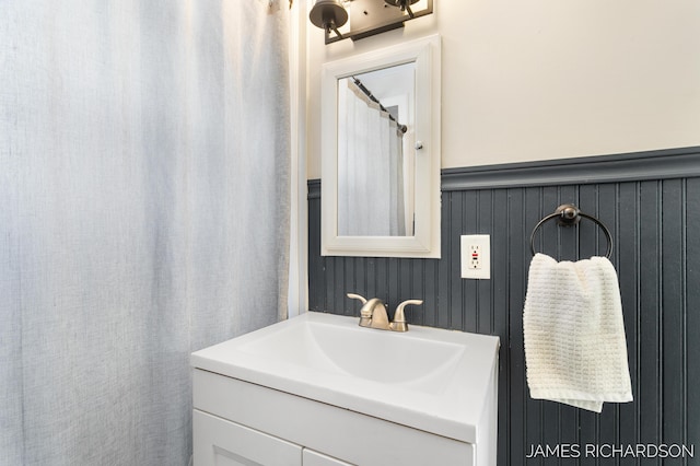 bathroom featuring wainscoting and vanity