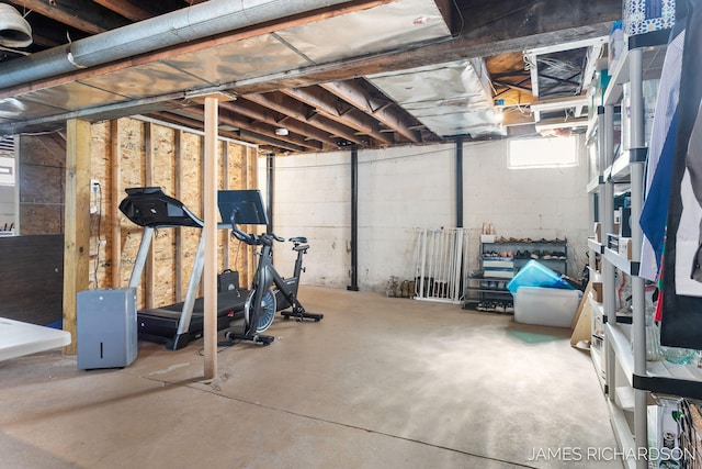 interior space with concrete block wall