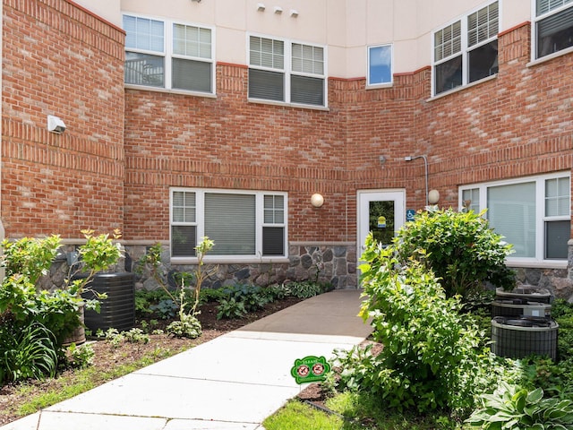 doorway to property with central AC