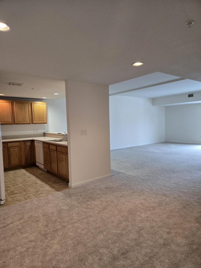 kitchen featuring light carpet, sink, and white appliances