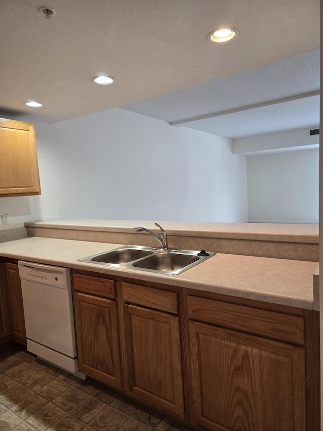 kitchen featuring sink and white dishwasher