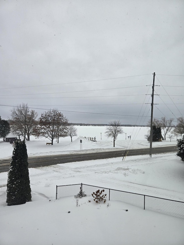 view of yard layered in snow