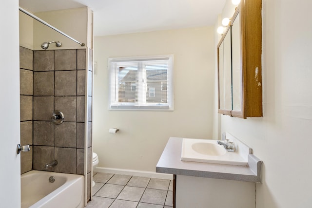 full bathroom featuring vanity, toilet, tile patterned floors, and tiled shower / bath