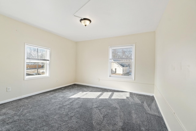 empty room with dark carpet