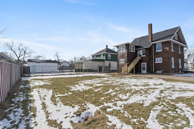 view of yard covered in snow