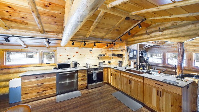 6919 E Free Soil Rd, Free Soil, MI 49411 - kitchen featuring vaulted ceiling with beams, stainless steel electric range, rail lighting, wood ceiling, and rustic walls