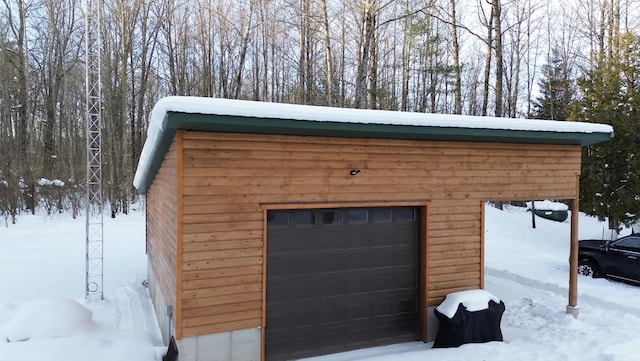 6919 E Free Soil Rd, Free Soil, MI 49411 - view of snow covered garage