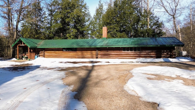 6919 E Free Soil Rd, Free Soil, MI 49411 - exterior space with metal roof and log exterior