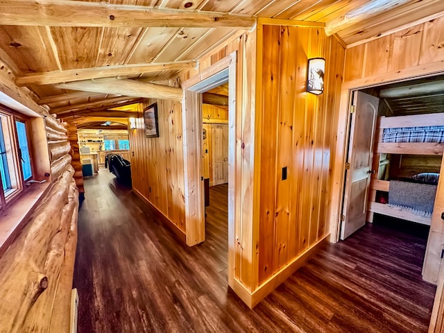 6919 E Free Soil Rd, Free Soil, MI 49411 - hallway featuring beam ceiling, dark wood finished floors, rustic walls, wooden walls, and wooden ceiling
