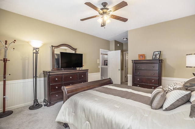 bedroom with ceiling fan and light colored carpet