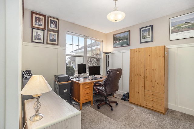 office area featuring light carpet