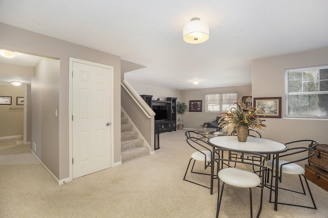 view of carpeted dining area