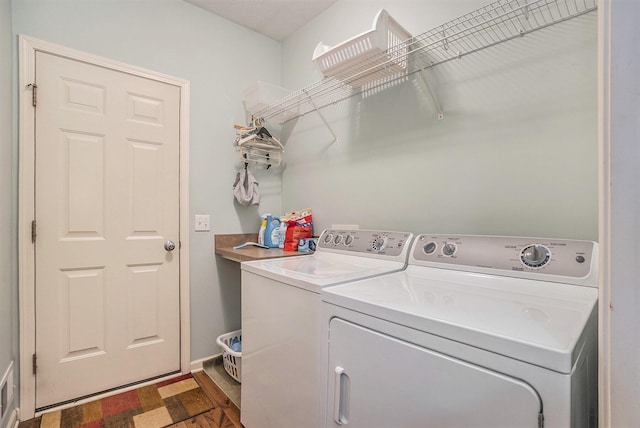 washroom featuring washing machine and dryer and hardwood / wood-style floors