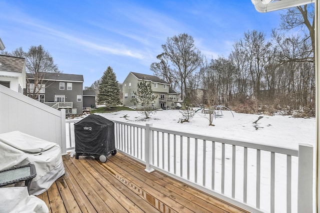 snow covered deck with grilling area