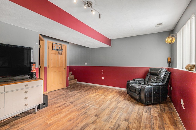 living area with wood-type flooring