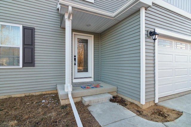 doorway to property featuring a garage