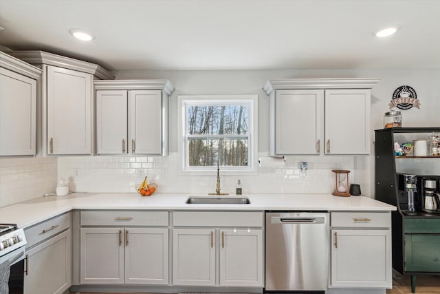 kitchen with tasteful backsplash, dishwasher, sink, and gas range