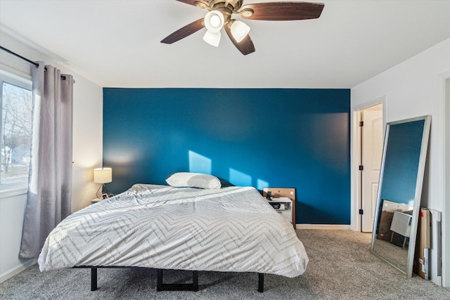 carpeted bedroom featuring ceiling fan