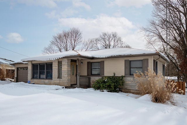 ranch-style house featuring a garage