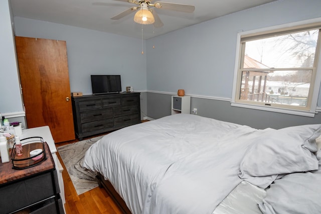 bedroom featuring light hardwood / wood-style floors and ceiling fan