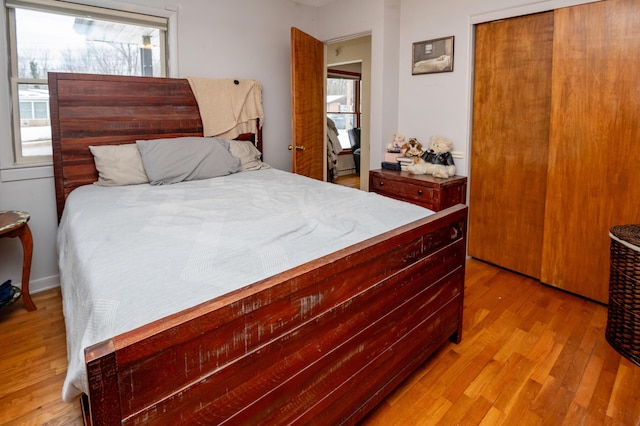 bedroom with a closet and light wood-type flooring