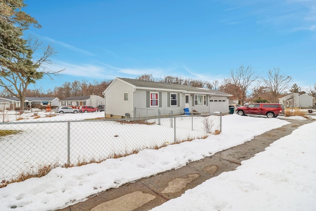 view of front of house featuring a garage, a residential view, and fence