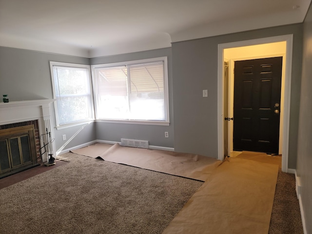 unfurnished living room with carpet floors