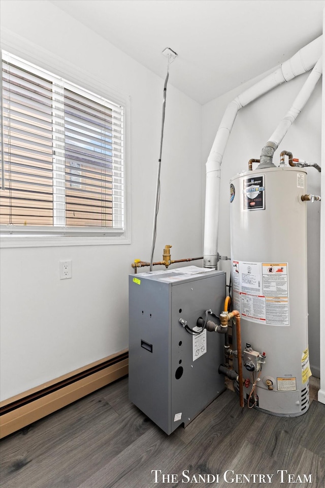 utility room with a baseboard heating unit and gas water heater