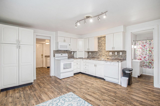 kitchen with backsplash, white appliances, dark hardwood / wood-style flooring, and white cabinets