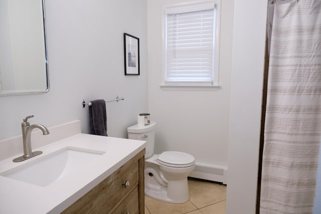 bathroom with tile patterned floors, toilet, vanity, and a baseboard heating unit