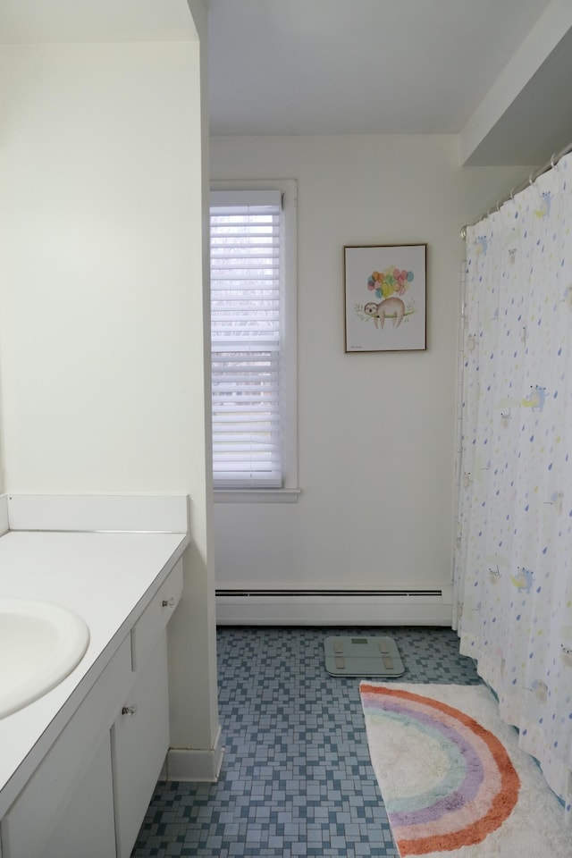 bathroom featuring vanity and a baseboard heating unit