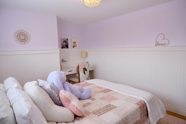 bedroom with hardwood / wood-style floors