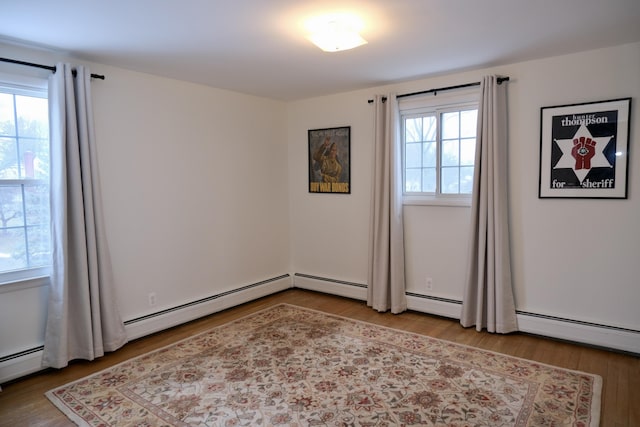 spare room featuring hardwood / wood-style floors