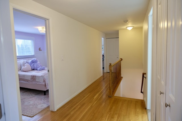 hall with light hardwood / wood-style floors