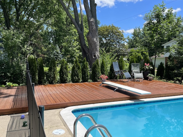 view of swimming pool featuring a deck