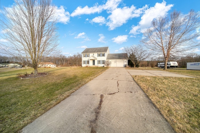 view of front of home with a garage and a front yard