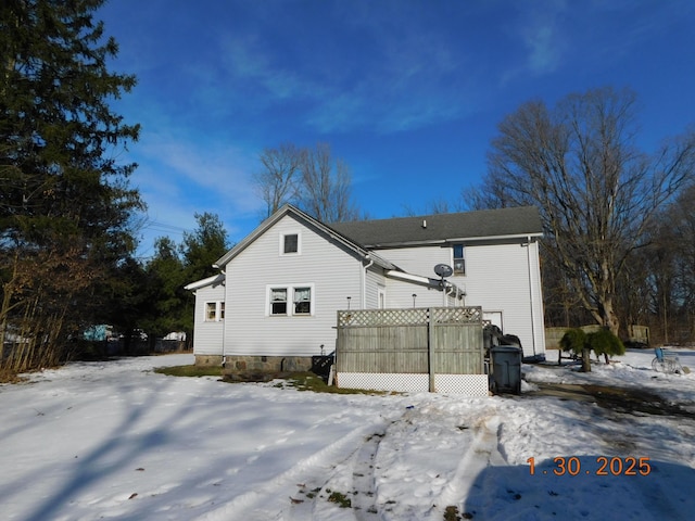 view of snow covered house