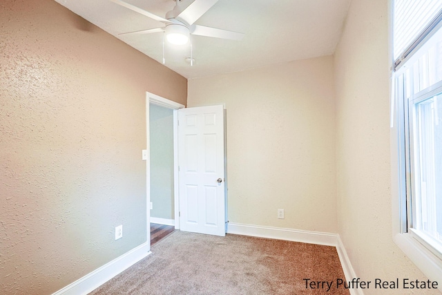 carpeted empty room with ceiling fan