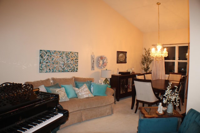 carpeted living area featuring high vaulted ceiling and a notable chandelier