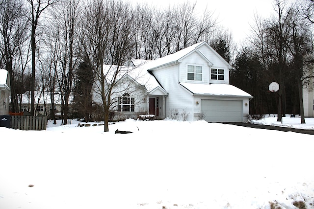 traditional-style home featuring a garage