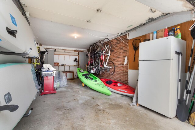 5410 Country Aire Dr Unit 13, Coloma, MI 49038 - garage featuring white refrigerator