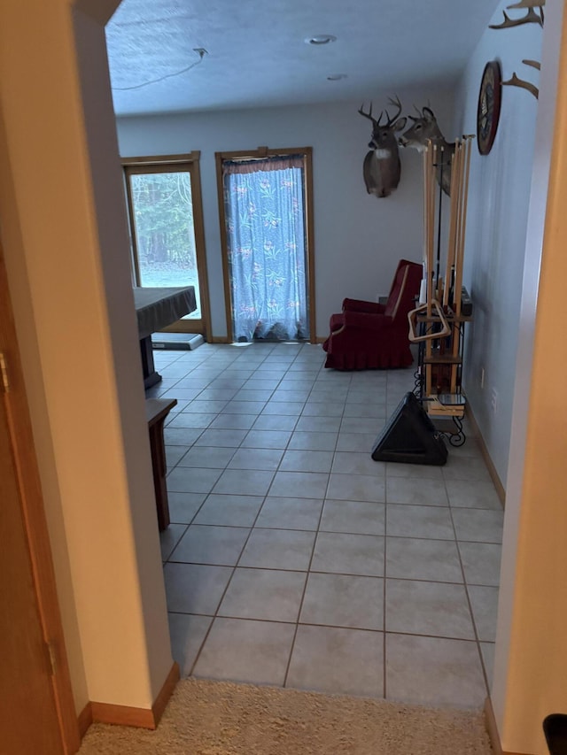 hall with light tile patterned flooring