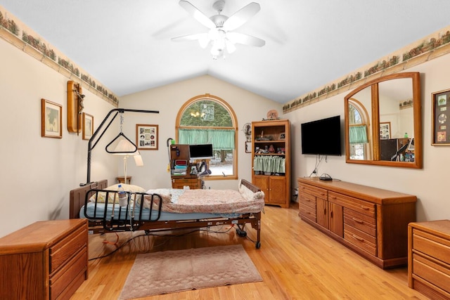 dining area featuring vaulted ceiling, ceiling fan, and light hardwood / wood-style floors